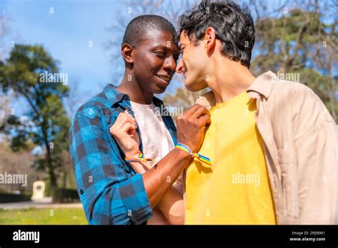 Portrait Of Multiethnic Gay Male Couple On A Romantic Walk In The Park Lgbt Concept Stock Photo