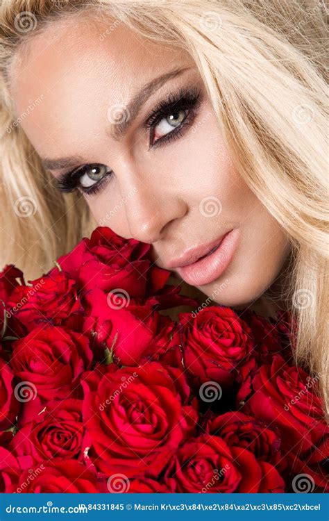 Portrait Of The Beautiful Blonde Woman And Amazing Looks And Long Hair Perfect Skin Keeps The