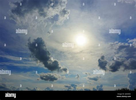 Hot Sun Shining Through Clouds Stock Photo Alamy