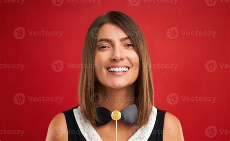 Attractive Brunette Woman Posing With New Year Photo Gadgets Over Red Background Stock