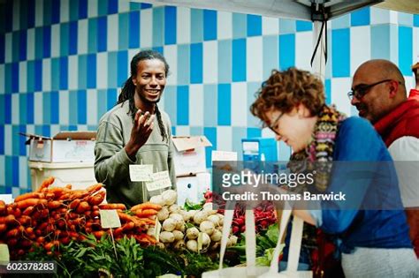 Farmer Selling Produce At Farmers Market High Res Stock Photo Getty