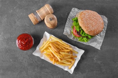 Premium Photo Paper Container With Yummy French Fries And Hamburger