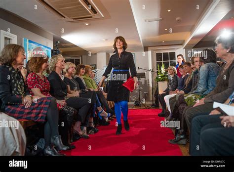 A Woman Taking Part In An Amateur Fashion Show Catwalk To Raise Money For Cancer Research UK