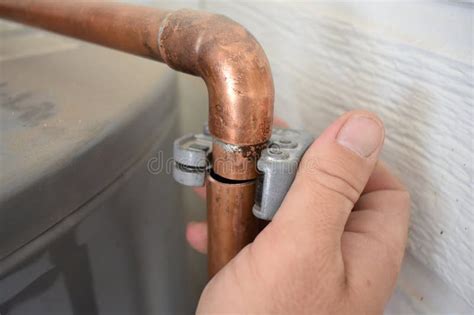 Hand Cutting A Copper Pipe While Installing A Water Heater Stock Image Image Of Homeowner