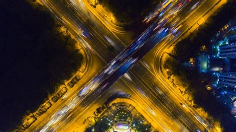 Premium Photo | Road interchange and overpass tollway at night