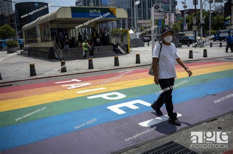 A Pedestrian Passes By Gay Friendly Xinmen Shopping Promenade Decorated With Rainbow Flag In