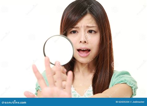 Shocked Young Woman Looking Through A Magnifying Glass Her Nails Stock