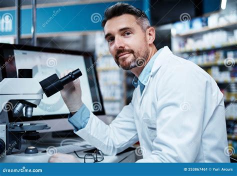 Lets Make Some Discoveries A Mature Man Using A Microscope While