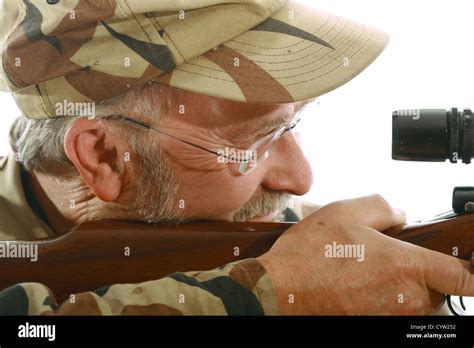 Hunter Looking Through The Scope Of His Riffle Stock Photo Alamy