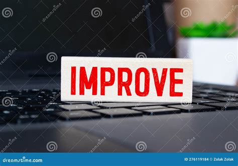 word improve   center  dark black cement wooden block stock