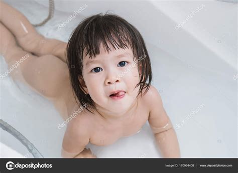 Happy Asian Babe Playing Bath Looking Camera Stock Photo By Paulaphoto
