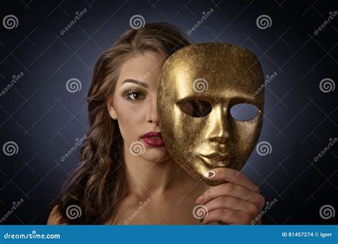 Woman With Gold Carnival Mask On A Black Background Stock Photo Image