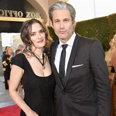 Scott Mackinlay Hahn And Winona Ryder wearing black dress posing at camera