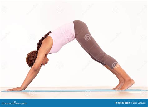 Arching Her Back A Young African American Woman Performing A Yoga