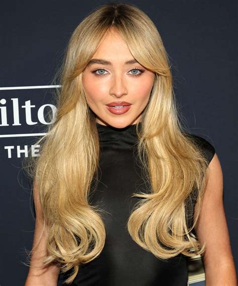 Sabrina Carpenter Long Blonde Hairstyle With Curtain Bangs