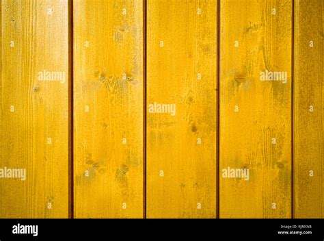 Yellow Orange Painted Wooden Wall Plank Perpendicular To The Frame As