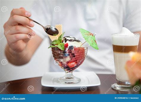 Tasting A Cup Of Ice Cream With Fruits And Coffee Stock Photo Image