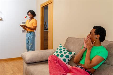 Premium Photo Gay Man Surprising His Partner With Cake And A Rose