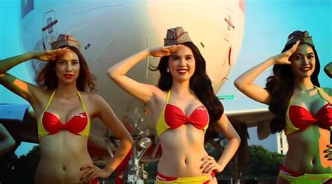 This Airline Has Hot Air Hostesses Dressed In Red And Yellow Bikinis