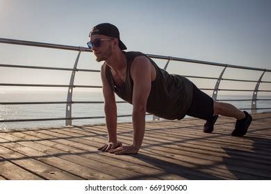 Muscular Handsome Man Naked Torso Practicing Stock Photo