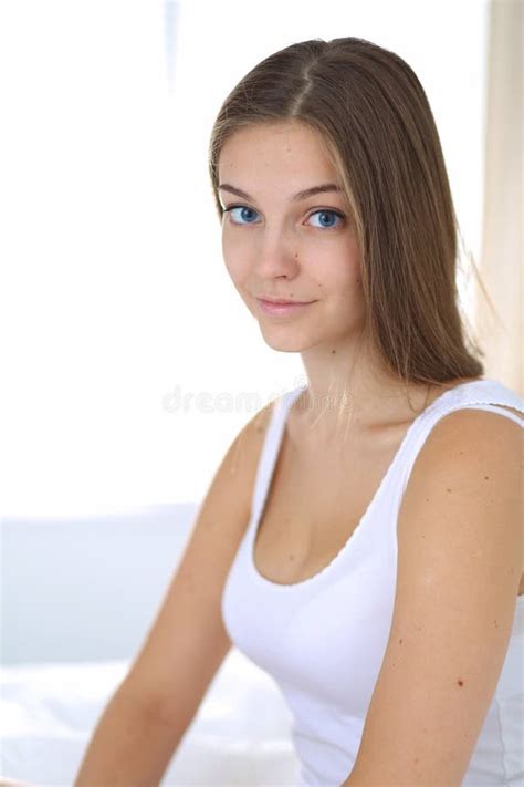 A Pretty Young Woman Sitting In Bed Stock Image Image Of Happiness