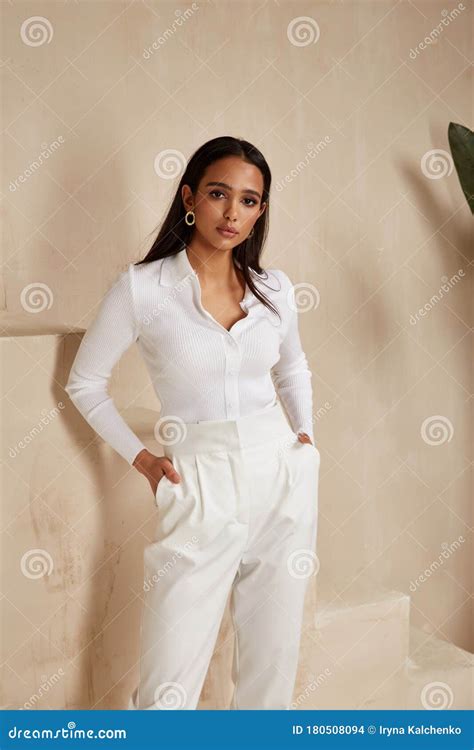Beautiful Brunette Woman Tanned Skin Face Cosmetic Makeup Wear White Suit Pants For Date Walk