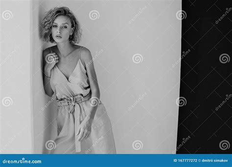 Portrait Of A Beautiful Woman Blonde In A Fashionable Jumpsuit Stock Photo Image Of Model