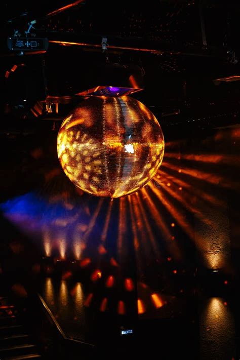 Disco Ball Hanging On The Ceiling Of The Disco Rays Of Light Are