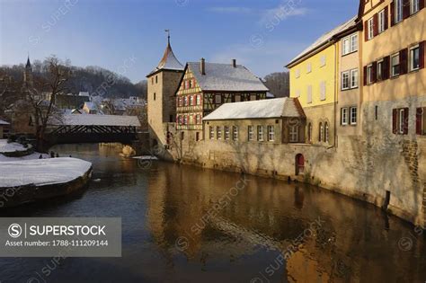 The Kocher river with the covered wooden bridge in the background ...