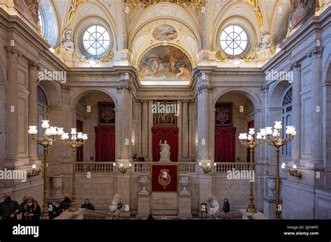 A luxurious Interior of the Royal Palace of Madrid with tourists Stock ...