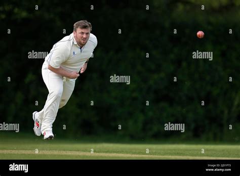 Cricket bowler in action Stock Photo - Alamy