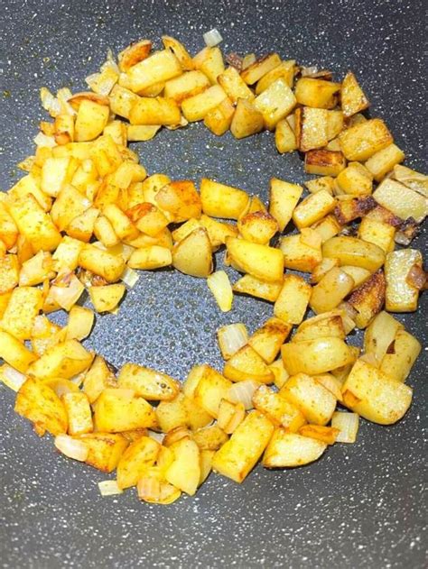 Crispy Potatoes Eggs And Onions Breakfast Skillet