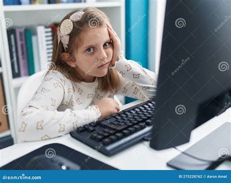Adorable Blonde Girl Student Tired Using Computer At Classroom Stock Photo Image Of Caucasian