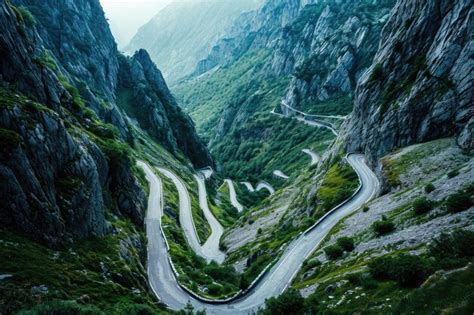 Premium Photo Scenic Winding Mountain Road In The Heart Of A Valley A