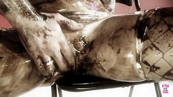 A Mischievous Brunette And Her Partner Engage In Sensual Activities With Dark Oil And Engage In