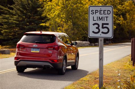 Car And A Speed Limit Sign Free Stock Photo - Public Domain Pictures