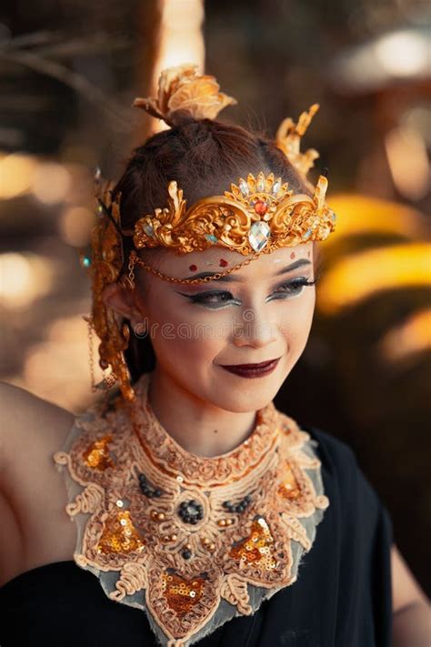 Beautiful Tribe Woman Wearing A Gold Queen Crown While Wearing A Black