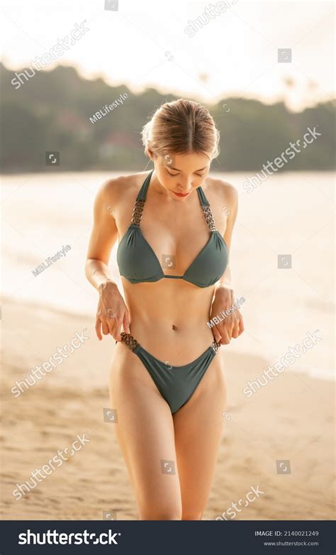 Woman Green Bikini Walking On Beach Stock Photo Shutterstock