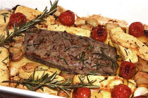 Lamb Roasted With Rosemary Feta Tomatoes And Garlic