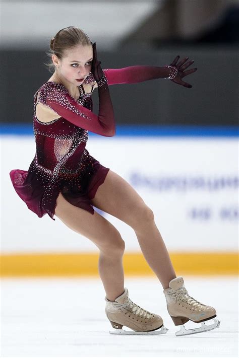 A Female Figure Skating On An Ice Rink