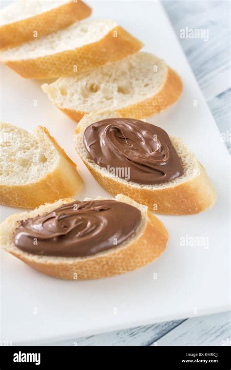 Slices Of Baguette With Chocolate Cream Stock Photo Alamy