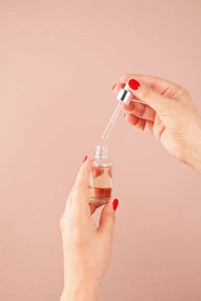 Serum Dropper Hands Stock Photos Pictures And Royalty Free Images Istock