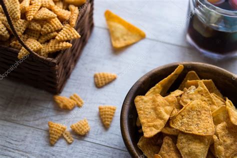 Chips (Snacks) and Beverage on a white wooden surface. Stock Photo by ...