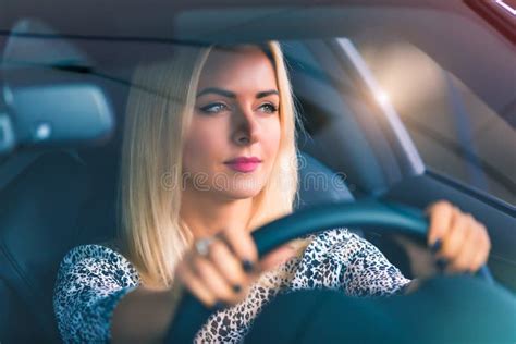 Young woman driving a car stock image. Image of handsome - 107132835