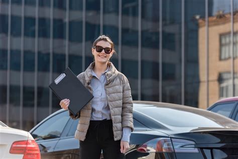 Free Photo Brunette Businesswoman Posing With Sunglasses