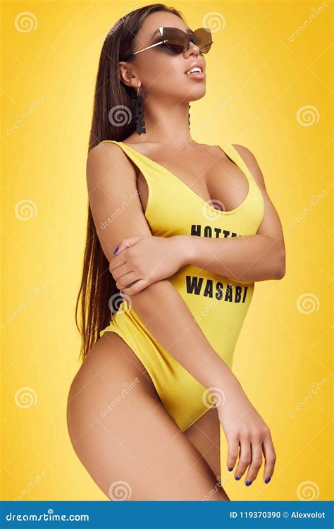 Gorgeous Beautiful Brunette With Perfect Body Wearing Yellow Swimsuit Stock Photo Image Of