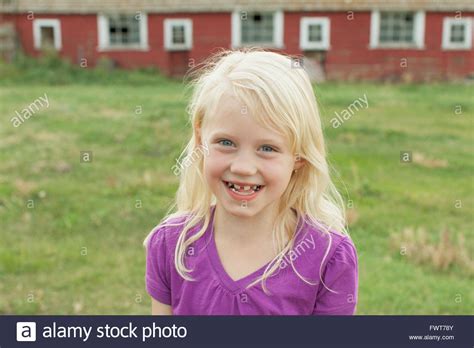 Portrait Of Cute Blonde Girl With Toothy Smile Stock Photo Alamy