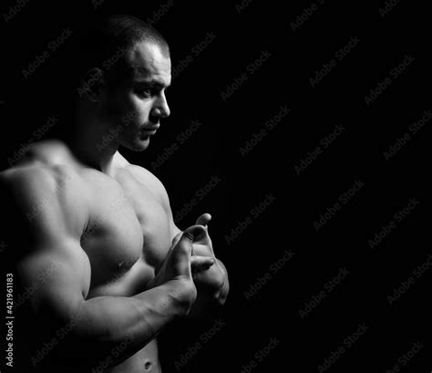 Black And White Portrait Focused Brutal Strong Muscular Man Standing Shirtless Naked Sideways