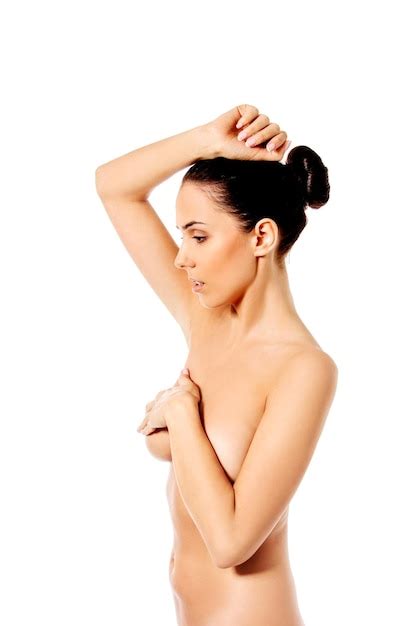 Premium Photo Side View Of Naked Woman Covering Breasts Against White Background