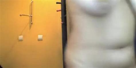 Chubby Brunette Undressing In Tanning Room Tnaflix